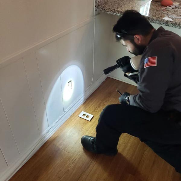 man checking electrical